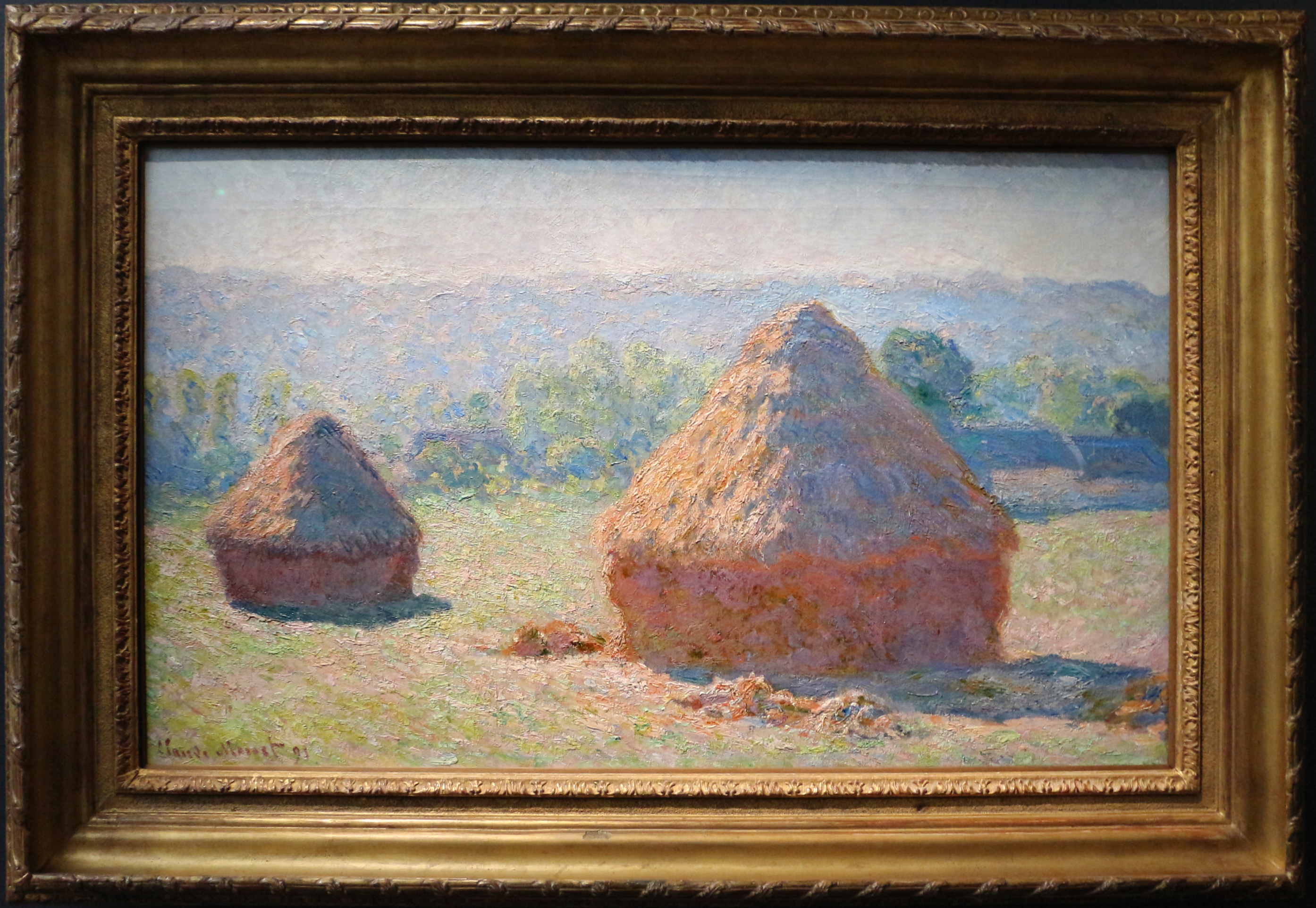 クロード・モネ「積みわら、夏の終わり」（1890年）オルセー美術館所蔵——印象派の連作技法を示す