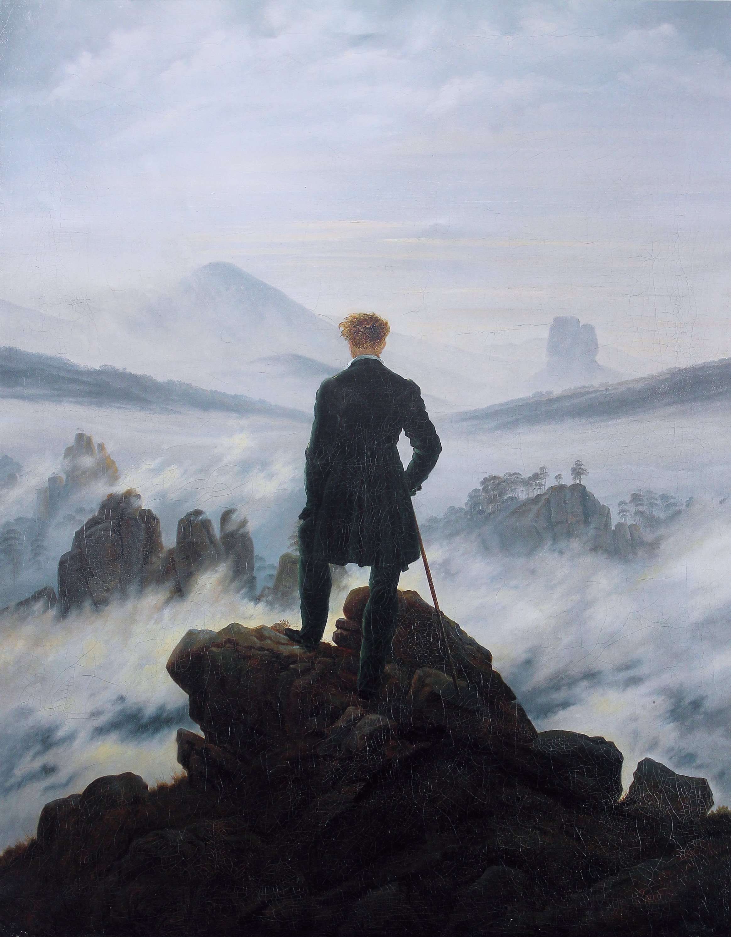 カスパー・ダーヴィト・フリードリヒ「霧の海の上の旅人」（1818年頃）ハンブルク美術館所蔵——霧に沈む大自然の前に立つ孤独な人物像がロマン主義の崇高を体現する